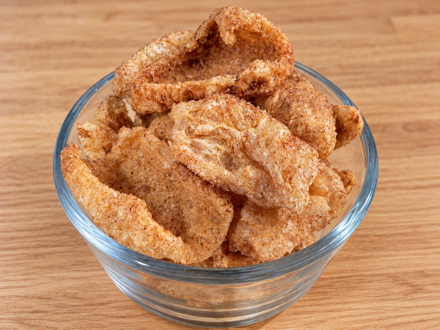 Keto cinnamon toast pork rinds coated in sweet cinnamon seasoning