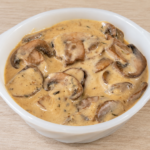 Creamy mushroom cheese sauce made with Cooper Sharp cheese