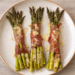 Prosciutto-wrapped asparagus with a melted Dubliner cheese crust