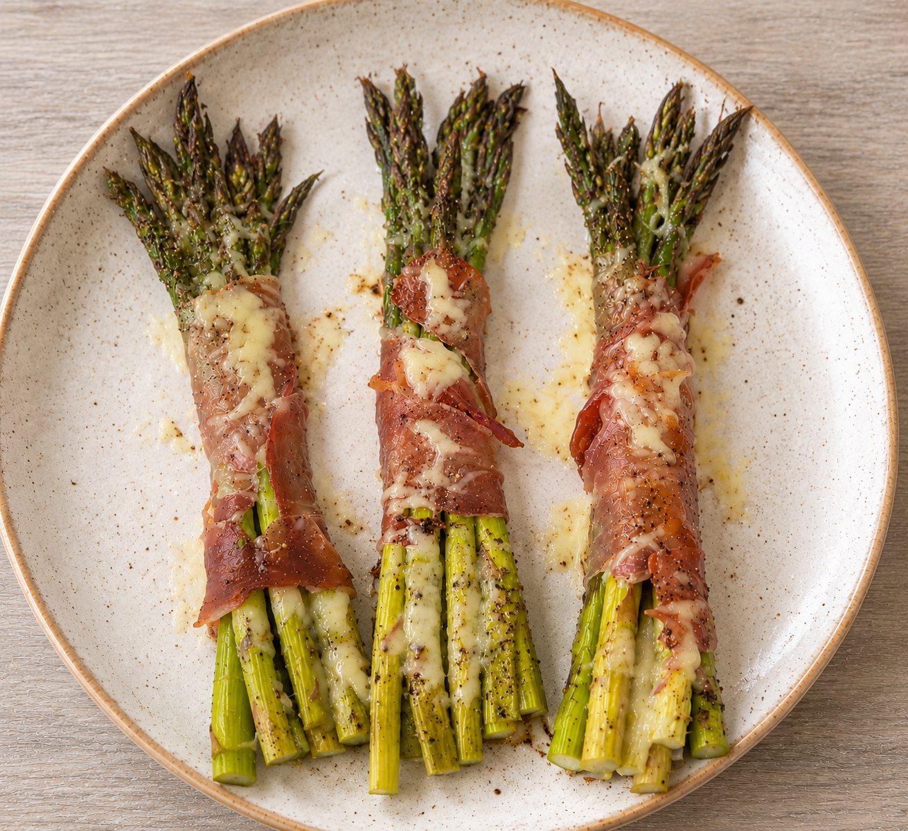 Prosciutto-wrapped asparagus with a melted Dubliner cheese crust